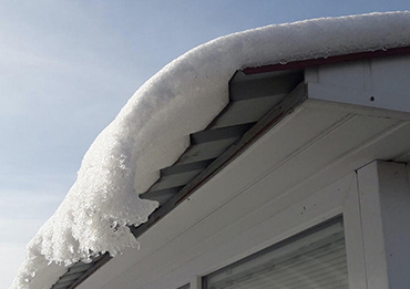 Cargas de neve em terças de telhado